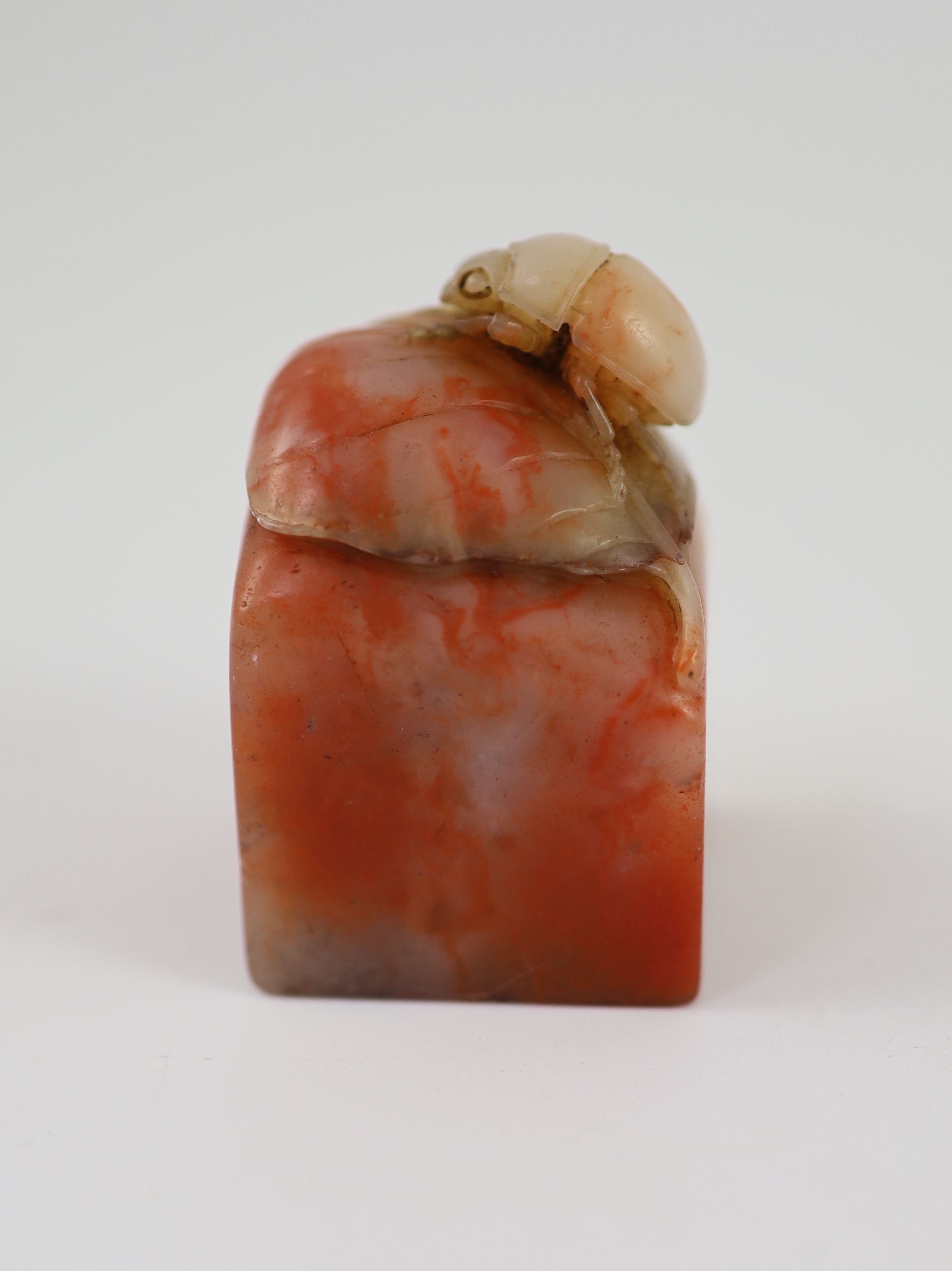 A Chinese ‘chicken’s blood’ soapstone seal, 5.5 cm high